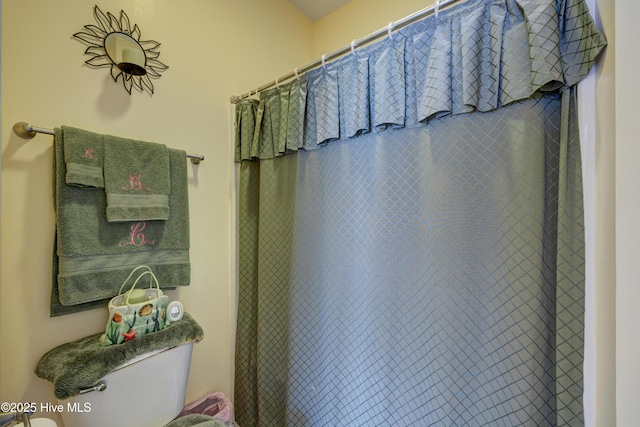 318 Winding Creek Rd, Rocky Point, NC 28457 - bathroom featuring toilet and a shower with shower curtain