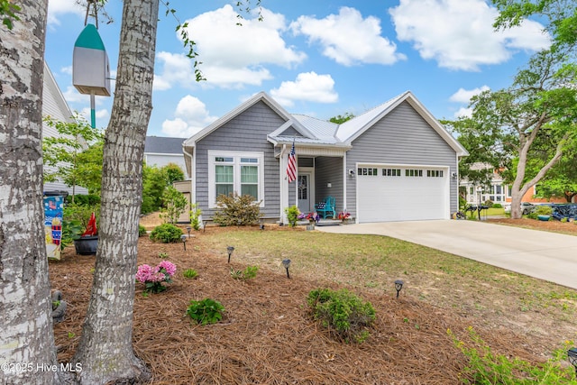 2402 W Oak Island Dr, Oak Island, NC 28465 - view of front of home with concrete driveway and an attached garage