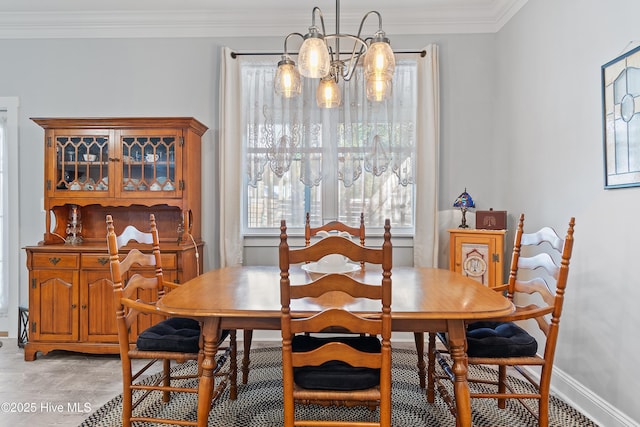 2402 W Oak Island Dr, Oak Island, NC 28465 - dining area with a chandelier, ornamental molding, light wood-type flooring, and baseboards