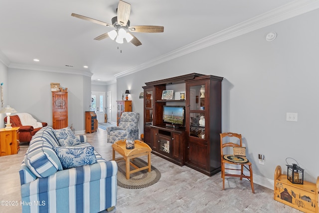 2402 W Oak Island Dr, Oak Island, NC 28465 - living area with ceiling fan, light wood-type flooring, crown molding, baseboards, and recessed lighting