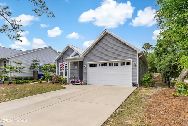 2402 W Oak Island Dr, Oak Island, NC 28465 - single story home featuring a garage and concrete driveway