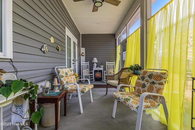 2402 W Oak Island Dr, Oak Island, NC 28465 - sunroom featuring ceiling fan