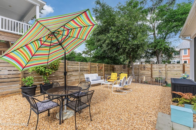 2402 W Oak Island Dr, Oak Island, NC 28465 - fenced backyard featuring a patio