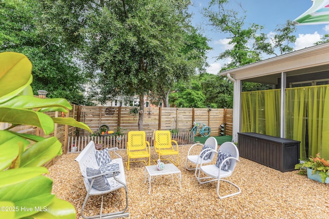 2402 W Oak Island Dr, Oak Island, NC 28465 - fenced backyard with a patio