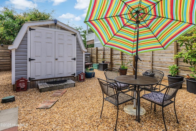 2402 W Oak Island Dr, Oak Island, NC 28465 - fenced backyard with outdoor dining area and a patio area