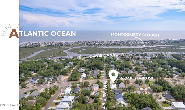 2402 W Oak Island Dr, Oak Island, NC 28465 - aerial view of residential area featuring a large body of water