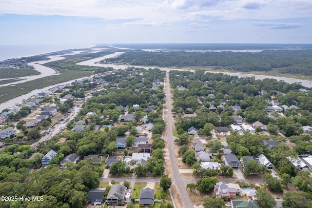 2402 W Oak Island Dr, Oak Island, NC 28465 - aerial perspective of suburban area with a nearby body of water