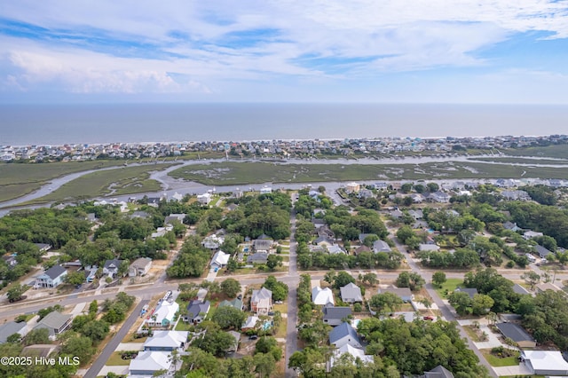 2402 W Oak Island Dr, Oak Island, NC 28465 - aerial overview of property's location with nearby suburban area and a large body of water