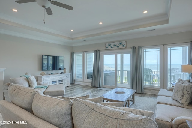 876 Villas Dr, North Topsail Beach, NC 28460 - living room with a tray ceiling, a ceiling fan, light wood-type flooring, recessed lighting, and ornamental molding