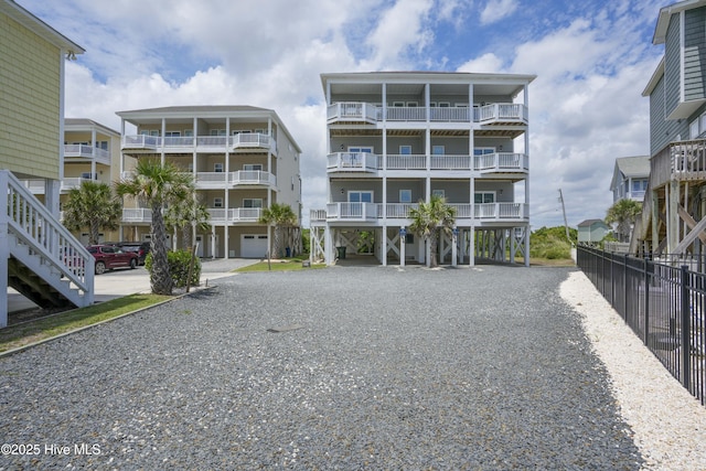 876 Villas Dr, North Topsail Beach, NC 28460 - view of apartment building / complex featuring a carport and driveway