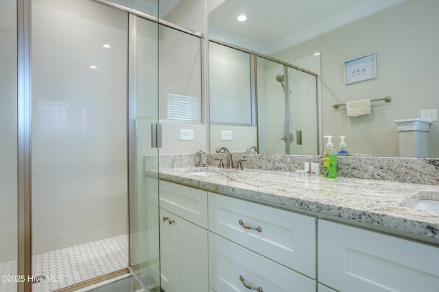 876 Villas Dr, North Topsail Beach, NC 28460 - full bathroom featuring double vanity, a stall shower, ornamental molding, and recessed lighting