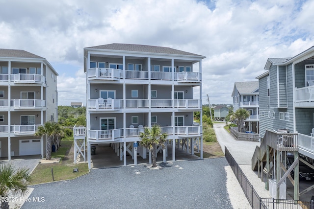 876 Villas Dr, North Topsail Beach, NC 28460 - view of building exterior with a carport and driveway