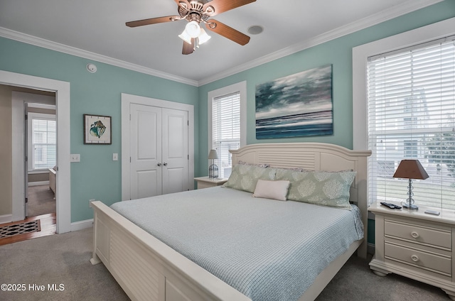 2 Clam Shell Ln Unit 6, Carolina Beach, NC 28428 - carpeted bedroom with a closet, ornamental molding, multiple windows, baseboards, and a ceiling fan