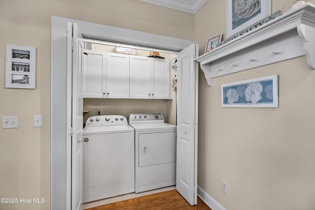 2 Clam Shell Ln Unit 6, Carolina Beach, NC 28428 - laundry area with cabinet space, separate washer and dryer, crown molding, and wood finished floors