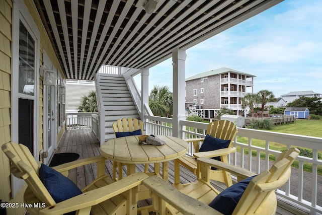 2 Clam Shell Ln Unit 6, Carolina Beach, NC 28428 - view of wooden balcony featuring a wooden deck and outdoor dining area