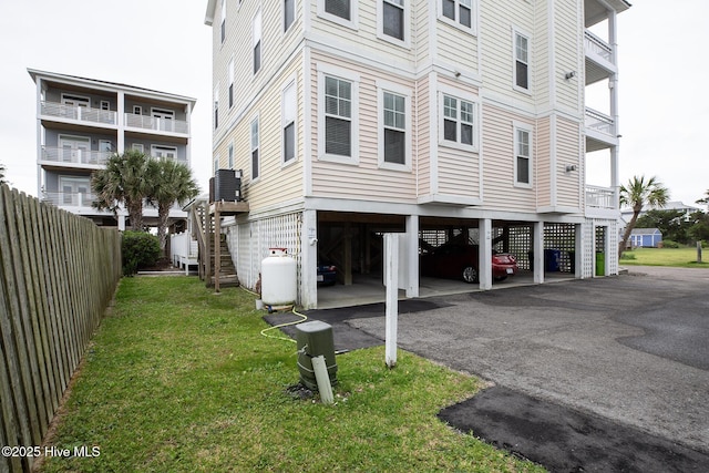 2 Clam Shell Ln Unit 6, Carolina Beach, NC 28428 - view of home's exterior featuring stairs, central AC, and a carport