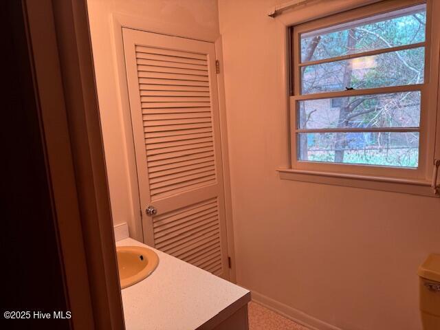430 W Rhode Island Ave, Southern Pines, NC 28387 - bathroom featuring healthy amount of natural light, vanity, and baseboards
