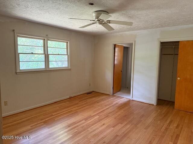 430 W Rhode Island Ave, Southern Pines, NC 28387 - unfurnished bedroom with a textured ceiling, light wood-type flooring, baseboards, a closet, and ceiling fan