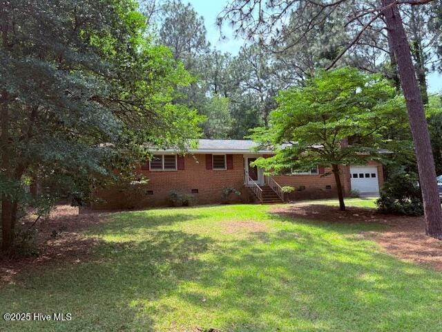430 W Rhode Island Ave, Southern Pines, NC 28387 - view of grassy yard featuring entry steps and dirt driveway