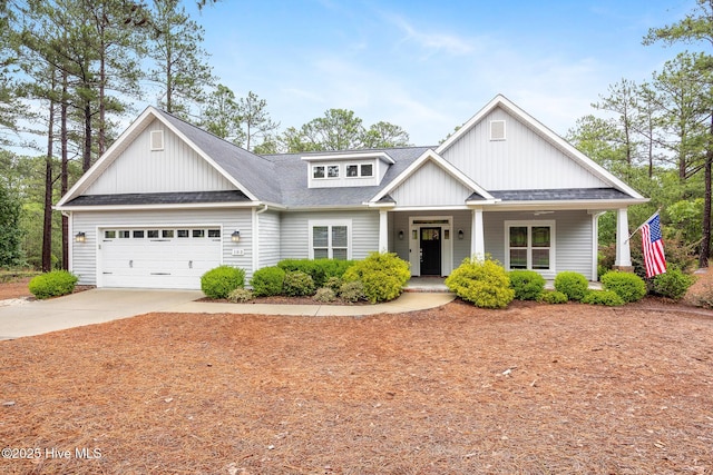 103 Schever Rd, West End, NC 27376 - craftsman inspired home featuring a garage, driveway, roof with shingles, and a porch