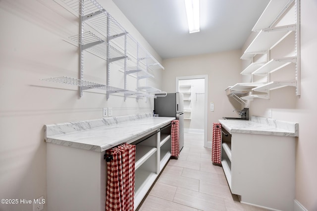 103 Schever Rd, West End, NC 27376 - kitchen featuring open shelves, a sink, freestanding refrigerator, and baseboards
