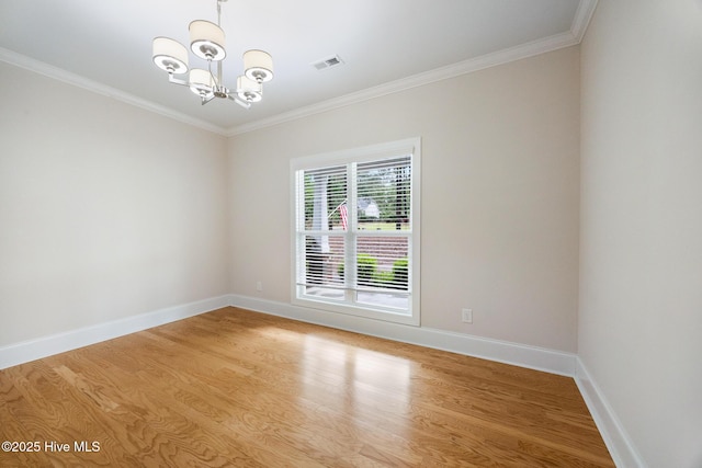 103 Schever Rd, West End, NC 27376 - spare room with a chandelier, light wood-style flooring, crown molding, and baseboards