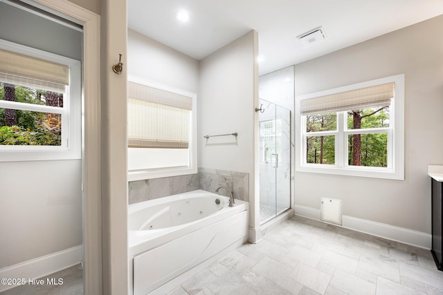 103 Schever Rd, West End, NC 27376 - bathroom featuring a whirlpool tub, a shower stall, vanity, and baseboards