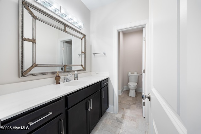 103 Schever Rd, West End, NC 27376 - bathroom featuring toilet, vanity, and baseboards