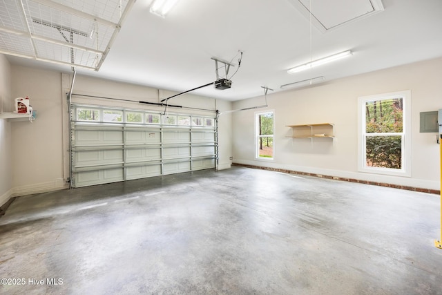 103 Schever Rd, West End, NC 27376 - garage featuring baseboards, a garage door opener, and electric panel