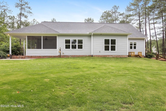 103 Schever Rd, West End, NC 27376 - back of house featuring a shingled roof, a lawn, and a sunroom