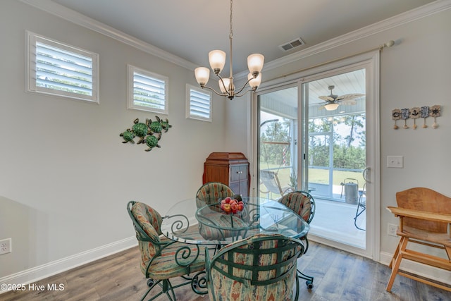 1337 Fence Post Ln, Carolina Shores, NC 28467 - dining space with wood finished floors, a chandelier, ornamental molding, and baseboards