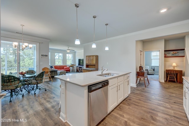 1337 Fence Post Ln, Carolina Shores, NC 28467 - kitchen with stainless steel dishwasher, a sink, crown molding, light wood-style flooring, and light countertops