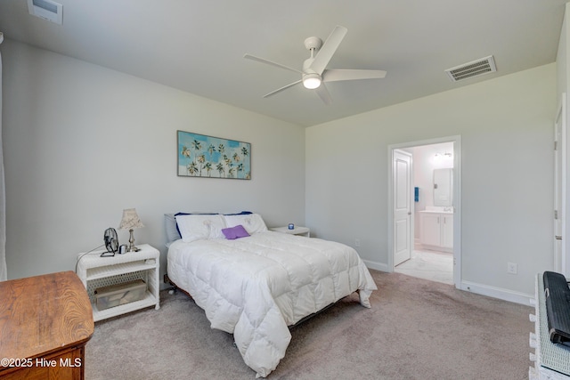 1337 Fence Post Ln, Carolina Shores, NC 28467 - carpeted bedroom featuring baseboards, connected bathroom, a ceiling fan, and heating unit