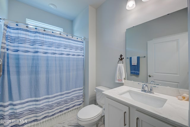 1337 Fence Post Ln, Carolina Shores, NC 28467 - bathroom featuring toilet, vanity, and curtained shower