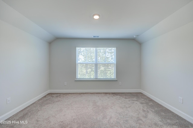 1337 Fence Post Ln, Carolina Shores, NC 28467 - carpeted spare room with lofted ceiling and baseboards