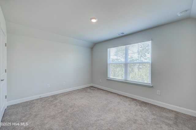 1337 Fence Post Ln, Carolina Shores, NC 28467 - carpeted spare room with vaulted ceiling and baseboards