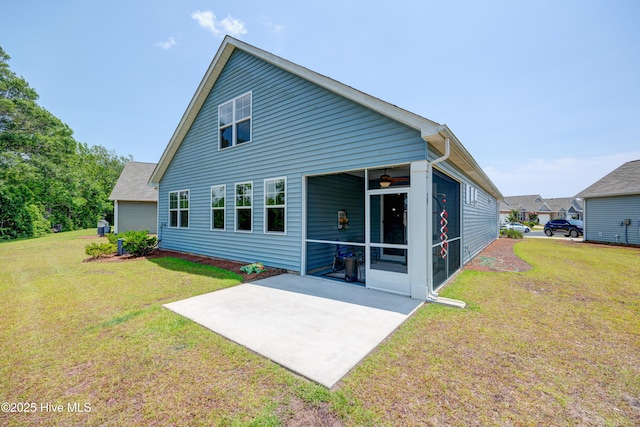 1337 Fence Post Ln, Carolina Shores, NC 28467 - back of property featuring a patio area, a yard, a ceiling fan, and a sunroom