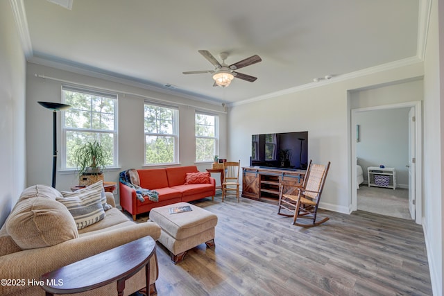 1337 Fence Post Ln, Carolina Shores, NC 28467 - living room featuring crown molding, wood finished floors, ceiling fan, and baseboards