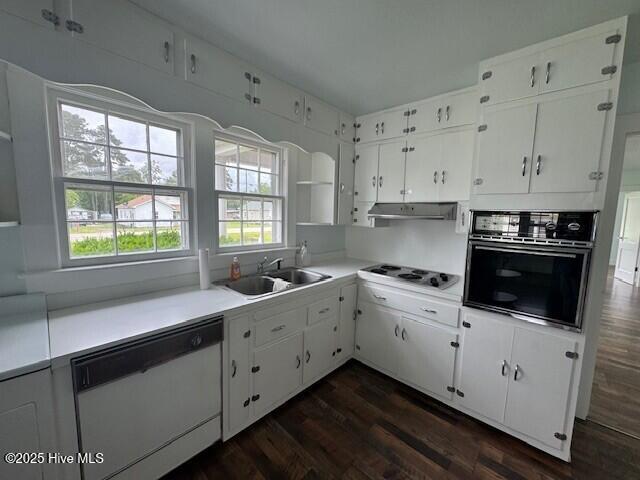 214 NC Highway 561 E, Ahoskie, NC 27910 - kitchen with oven, dishwashing machine, cooktop, under cabinet range hood, and a sink