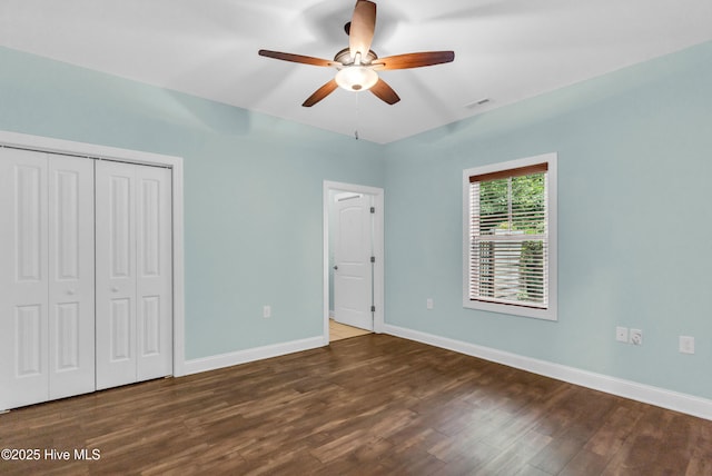 1120 Beasley Rd, Wilmington, NC 28409 - unfurnished bedroom with wood finished floors, a closet, and a ceiling fan