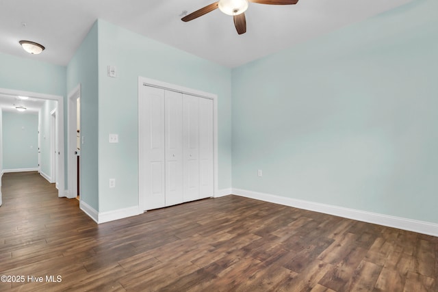 1120 Beasley Rd, Wilmington, NC 28409 - unfurnished bedroom featuring dark wood-style floors, a closet, and ceiling fan