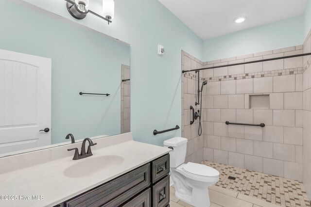 1120 Beasley Rd, Wilmington, NC 28409 - full bathroom featuring vanity, a tile shower, and tile patterned flooring