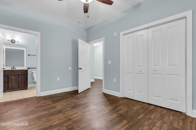 1120 Beasley Rd, Wilmington, NC 28409 - unfurnished bedroom with wood finished floors, a closet, ensuite bathroom, and ceiling fan