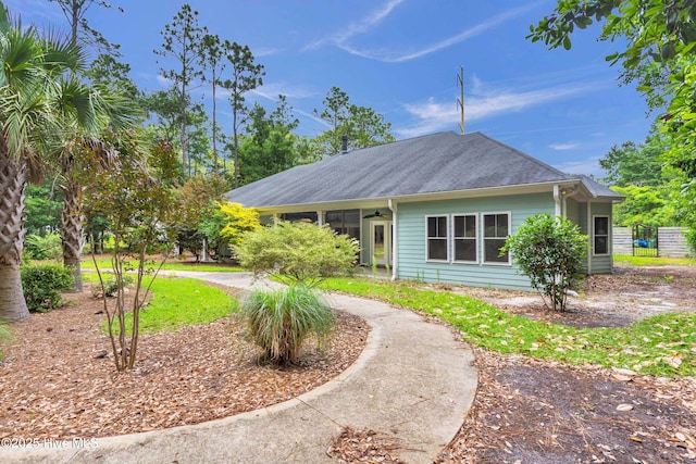 1120 Beasley Rd, Wilmington, NC 28409 - back of property with a ceiling fan and roof with shingles