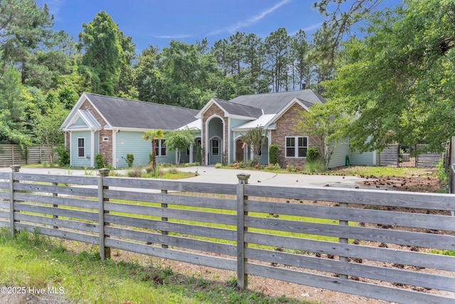 1120 Beasley Rd, Wilmington, NC 28409 - single story home with a fenced front yard and driveway