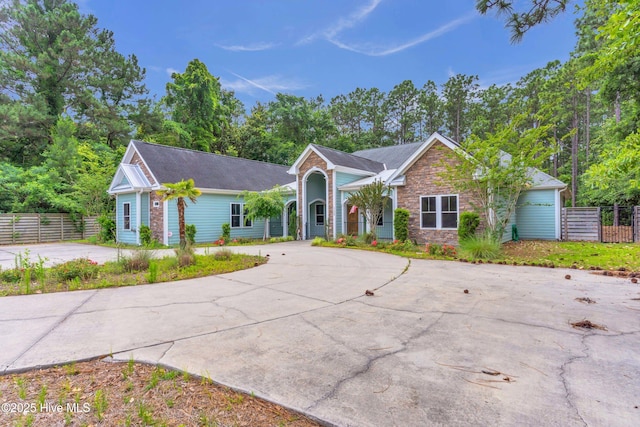 1120 Beasley Rd, Wilmington, NC 28409 - ranch-style home featuring curved driveway and stone siding