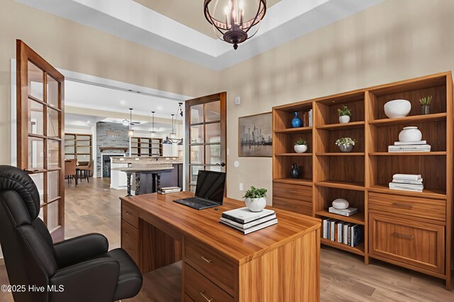 1120 Beasley Rd, Wilmington, NC 28409 - office area featuring light wood-style floors and a chandelier