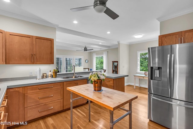 505 Rivage Promenade, Wilmington, NC 28412 - kitchen featuring stainless steel fridge, a ceiling fan, a peninsula, light wood-type flooring, and ornamental molding