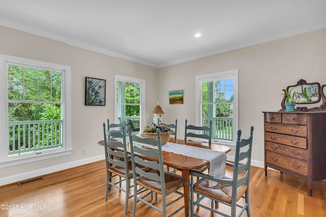 505 Rivage Promenade, Wilmington, NC 28412 - dining space featuring crown molding, light wood-style flooring, healthy amount of natural light, and recessed lighting