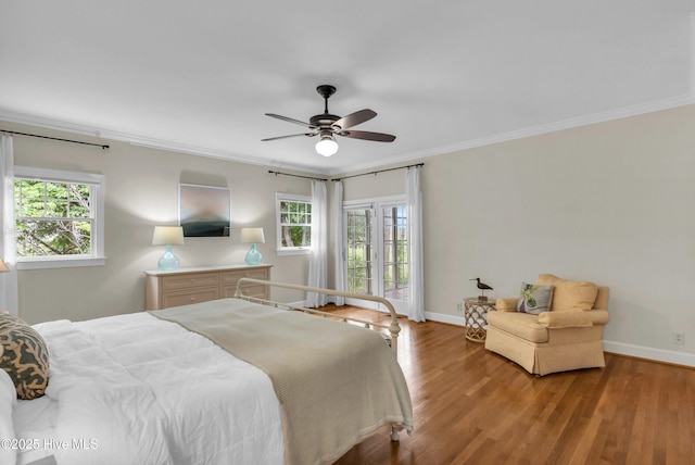505 Rivage Promenade, Wilmington, NC 28412 - bedroom featuring multiple windows, wood finished floors, crown molding, and ceiling fan